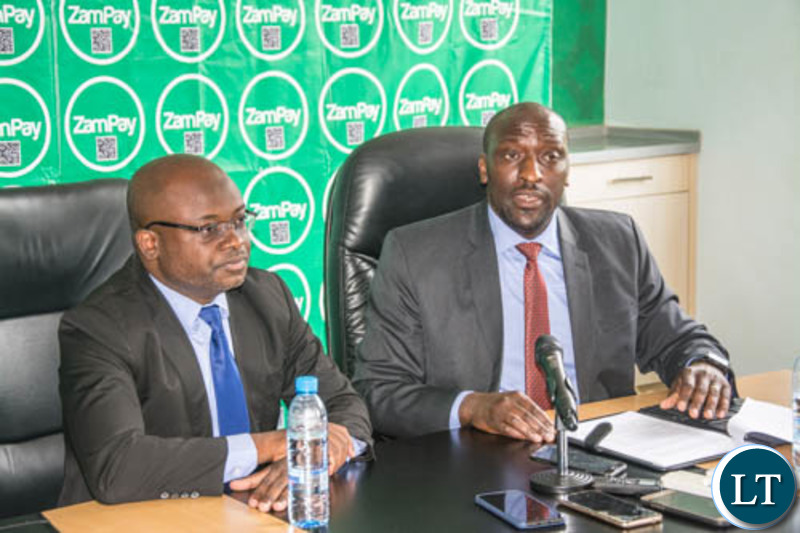 ZICTA Director General Patrick Mutimushi addressing the media during the launch of ZamSellit as Zamtel CEO Sydney Mupeta looks on.