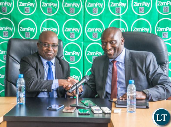 ZICTA Director General Patrick Mutimushi shakes hands with Zamtel CEO Mr Sydney Mupeta after the launch of ZamSellit ZICTA Director General Patrick Mutimushi shakes hands with Zamtel CEO Mr Sydney Mupeta after the launch of ZamSellit