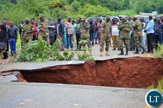 Government Delegation led by Presidential Affairs Minister Hon Freedom Sikazwe inspecting the washed away bridge Government Delegation led by Presidential Affairs Minister Hon Freedom Sikazwe inspecting the washed away bridge