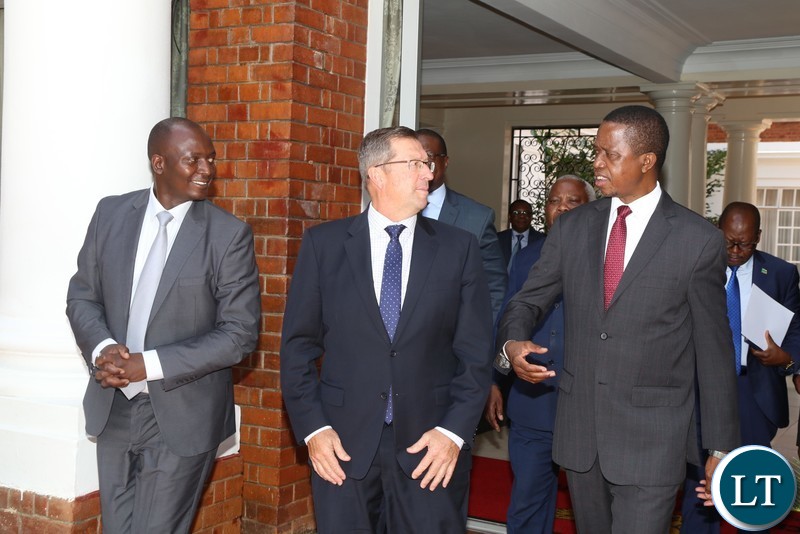 President Edgar Lungu talks to Lubambe Mine Chief Executive Officer Nick Bowen(c) while Mines Minister Richard Musukwa listens at State House