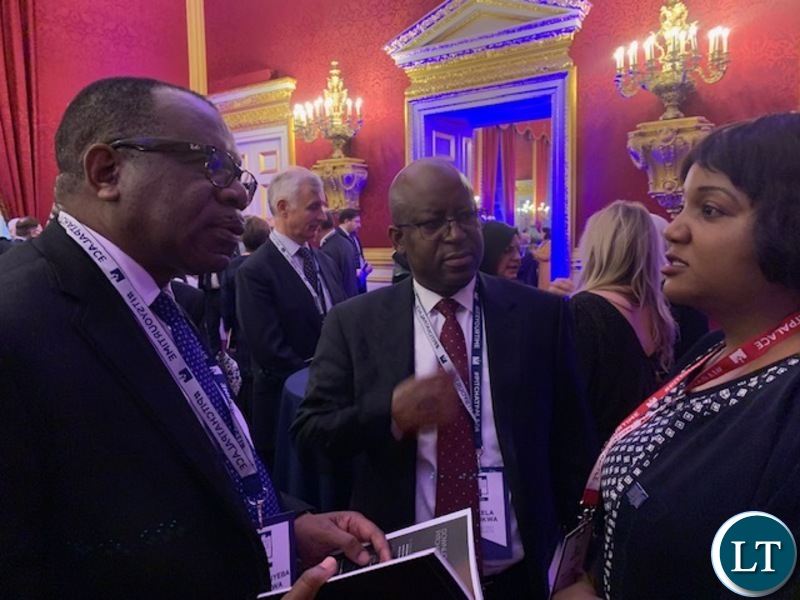 Zambia's High Commissioner to the United Kingdom His Excellency Mr. Muyeba Chikonde and Counselor Economic Mr. Mukela Mutukwa with Muzalema Mwanza at St James's Palace