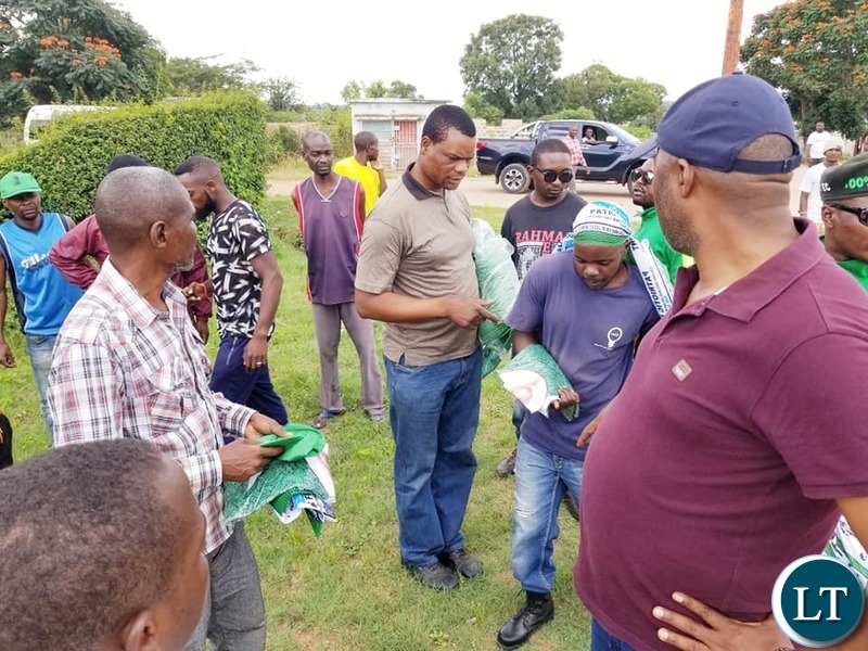 Kabushi Member of Parliament Bowman Lusambo on a Door to Door Campaign in Luanshya distributing campaign materials to voters