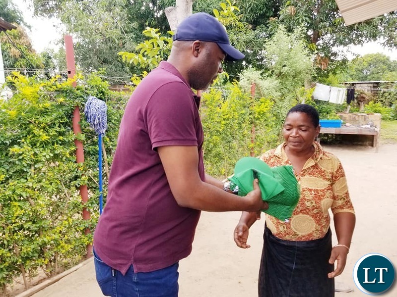 Kabushi Member of Parliament Bowman Lusambo on a Door to Door Campaign in Luanshya distributing campaign materials to voters