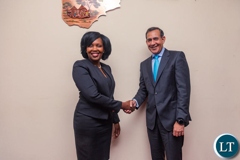 Mukwandi Chibesakunda, CEO of Natsave (left) and Raghu Malhotra, President of Middle East and Africa at Mastercard, celebrate the signing of the agreement