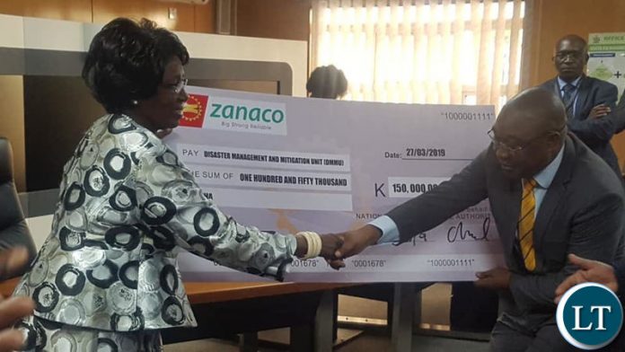 Vice President Inonge Wina receives a cheque from NAPSA Acting Director General Mr. Ronnie Kamanya