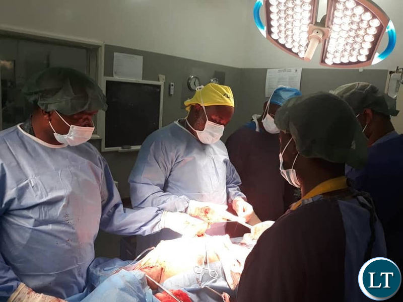 Ndola Teaching Hospital doctors operating on a patient