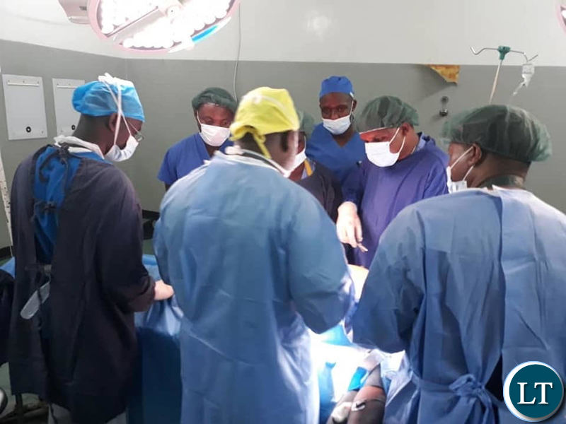 Ndola Teaching Hospital doctors operating on a patient