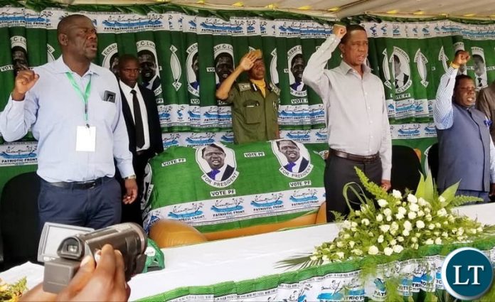 PF Secretary General Davis Mwila and President Lungu during the singing of the national Anthen During the opening of the Central Province Provincial Conference
