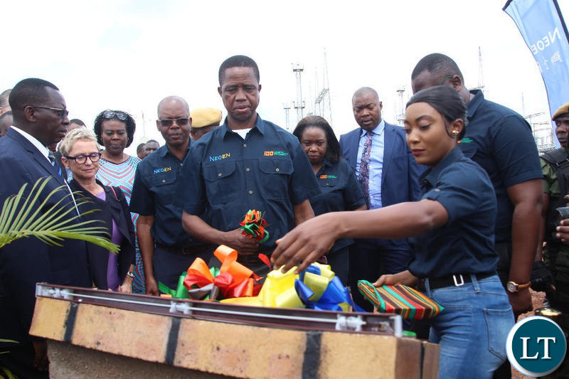President Edgar Lungu cuts the ribbon to officially commission the solar project