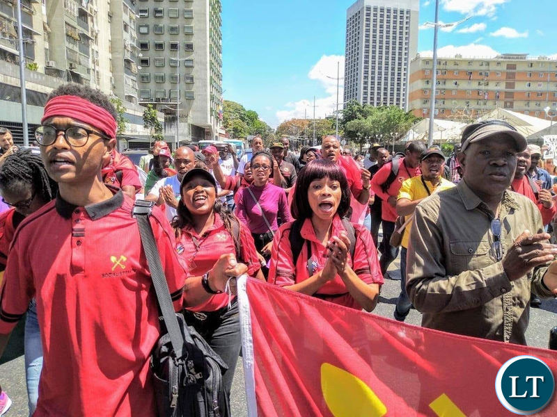 Socialist Party Zambia and 2021 presidential candidate Fred M'membe with members of the Socialist Youth League of Zambia march in solidarity for Venezuela's Leader Nicolas Maduro in Caracas recently.