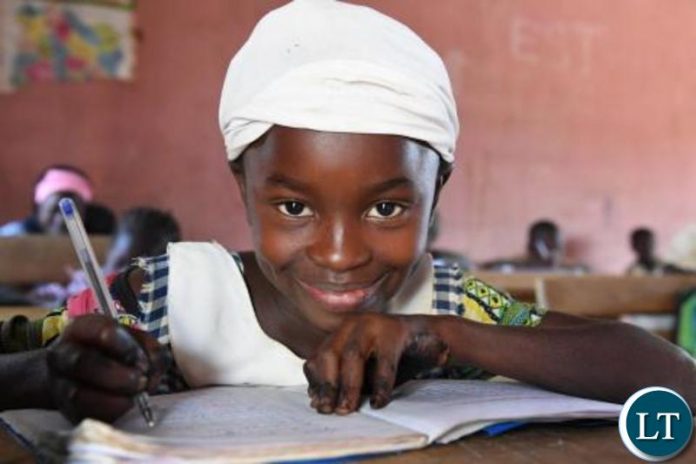 A girl attending class-PIX-UNICEF