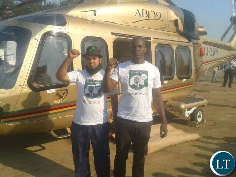 Huzaifa Jada with a fellow PF cadre pose for a photo near the presidential challenger plane.