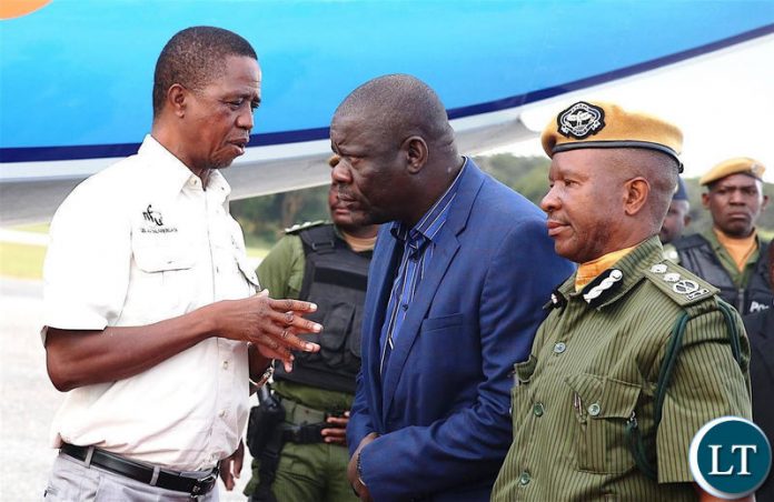 President Edgar Chagwa Lungu talks to PF Secretary General Davies Mwila at City Airport shortly before departure for Mansa, Luapula Province on Tuesday, April 23,2019-Pictures by THOMAS NSAMA