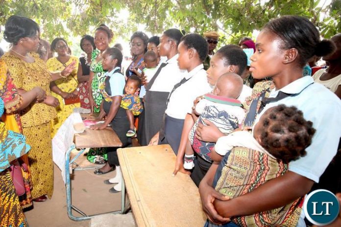 First lady with Young Mothers attending school
