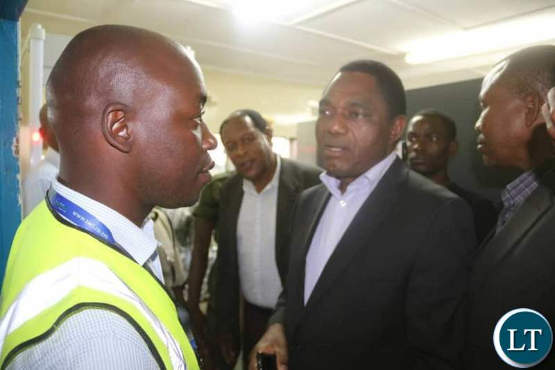 HH talks with an official from the Airports Corporation at the Simon Mwansa Kapwepwe airport