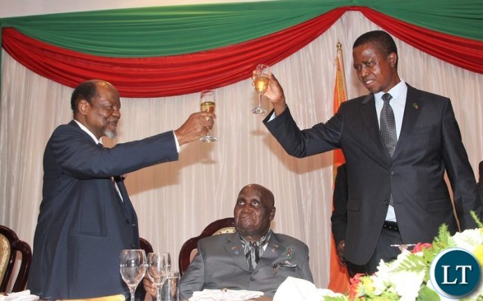 President Edgar Lungu proposing a toast to Chairperson of the Africa Forum and former Mozambican President Joaquim Chissano while KK is looking on.