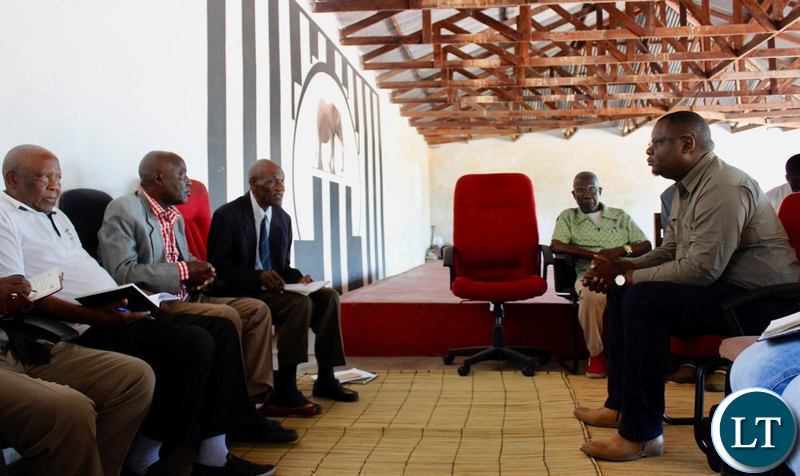The Ngambela (in black jacket) and Indunas at the Kuta with Mr Kaluba (right)
