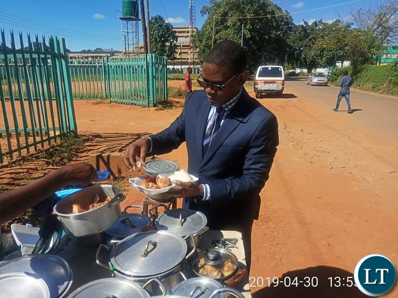 Chilufya Tayali captured buying Nshima from a street vendor in Lusaka
