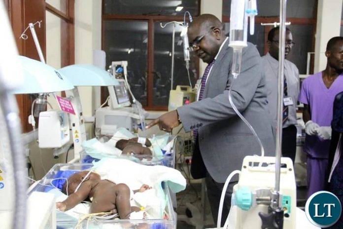 Minister of Health Dr. Chitalu Chilufya visiting the recovering twins