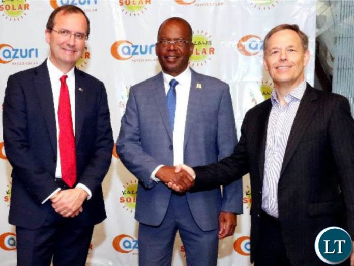 Azuri CEO Simon Bransfield-Garth (right) is pictured at the official launch in Zambia with British High Commissioner, Fergus Cochrane-Dyet (left), and Energy Minister Matthew Nkhuwa. Azuri CEO Simon Bransfield-Garth (right) is pictured at the official launch in Zambia with British High Commissioner, Fergus Cochrane-Dyet (left), and Energy Minister Matthew Nkhuwa.