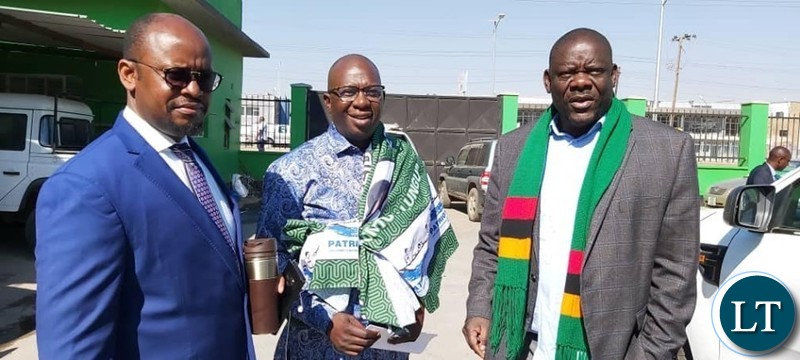 Patriotic Front Secretary General Davies Mwila welcoming UPND Member Bizwell Mutale.