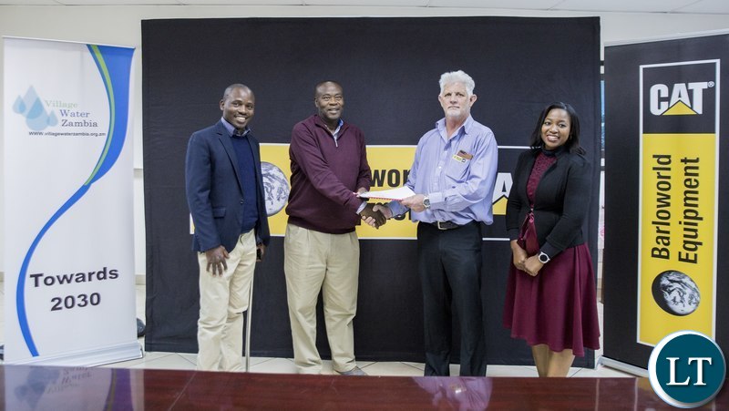 Village Water Zambia and Barloworld Equipment Zambia officials after the signing of the Zamtan Water Scheme Project MOU in Lusaka