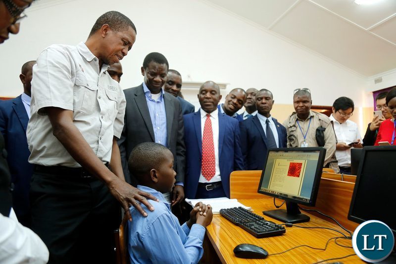 President Edgar Chagwa Lungu (left) talks to 13 year old Mutande Kalileka during the commissioning of Chati South Boarding Secondary School in Kalulushi on Sunday,July 7,2019. PICTURE BY SALIM HENRY/STATE HOUSE ©2019