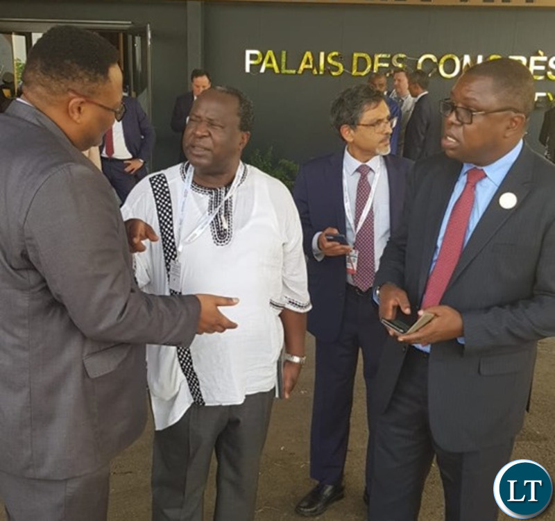Zambia's Ambassodor to Ethiopia Mr Emmanuel Mwamba with Zambia's Foreign Affairs Minister Joseph Malanji speaking to South Africa's Finance Minister Mr Tito Mboweni