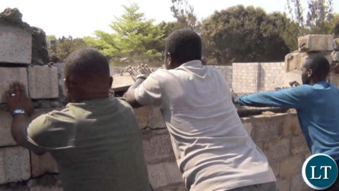 Zambia Police and Council Workers Demolishing the Houses of retired Munali Secondary School teachers