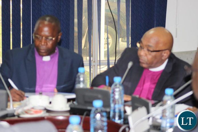 Members of the clergy representing the Evangelical Fellowship of Zambia making submissions to the parliamentary committee.