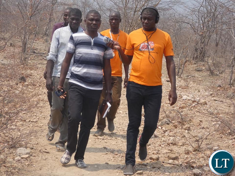 Journalist Fredinand Sianyuka from Chikuni Radio interviewing a local official during his tour of drought his areas in Pemba and Gwembe