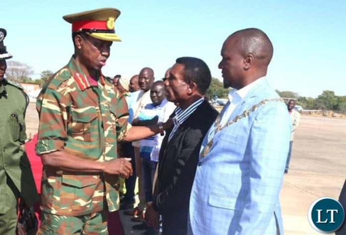 Commander in Chief of the Armed Forces, President Edgar Chagwa Lungu confers with Minister of Agriculture Hon Michael Katambo MP, at ZAF Lusaka Airbase shortly before departure for Mbala, Northern Province.