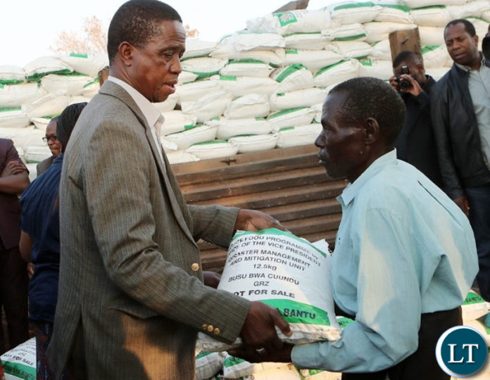 President Lungu dinating a Melalie meal bag to a draght viction