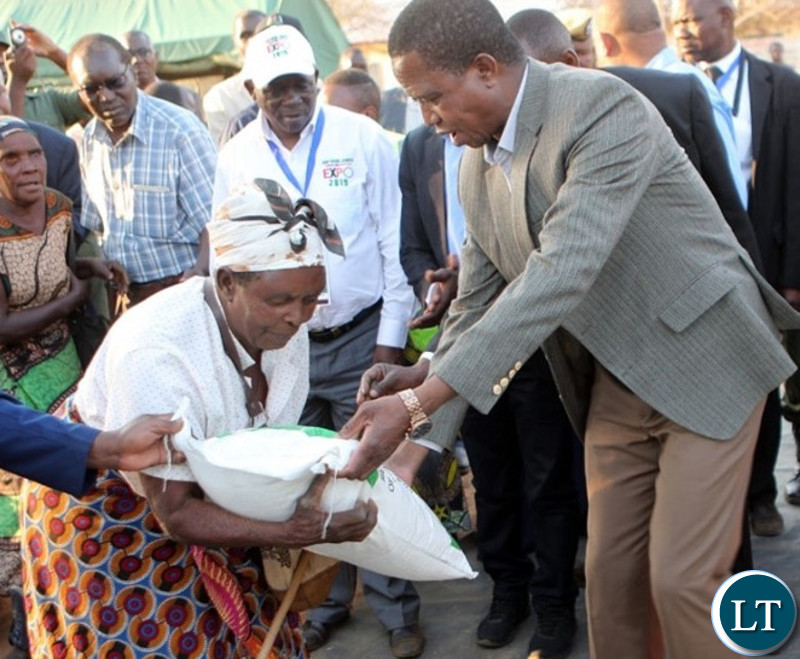 President Lungu donating a Mealie Meal bag to a draught victims in Southern Province