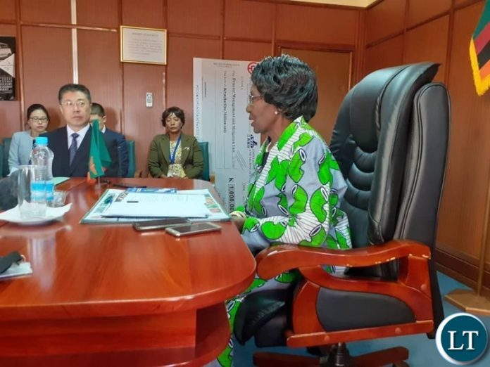 Vice President Inonge Wina Receiving a K1 Million Cheque from China Jiangxi International Economic and Technical Cooperation Limited towards the hunger mitigation in some parts of the country. Vice President Inonge Wina Receiving a K1 Million Cheque from China Jiangxi International Economic and Technical Cooperation Limited towards the hunger mitigation in some parts of the country.