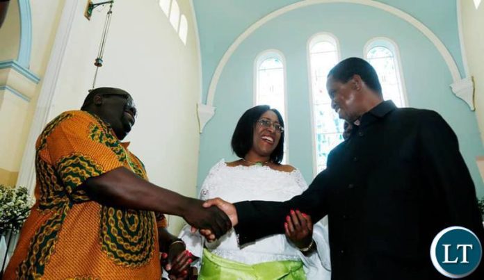 President Edgar Chagwa Lungu (right) extends his hands to Chishimba Kambwili (left)