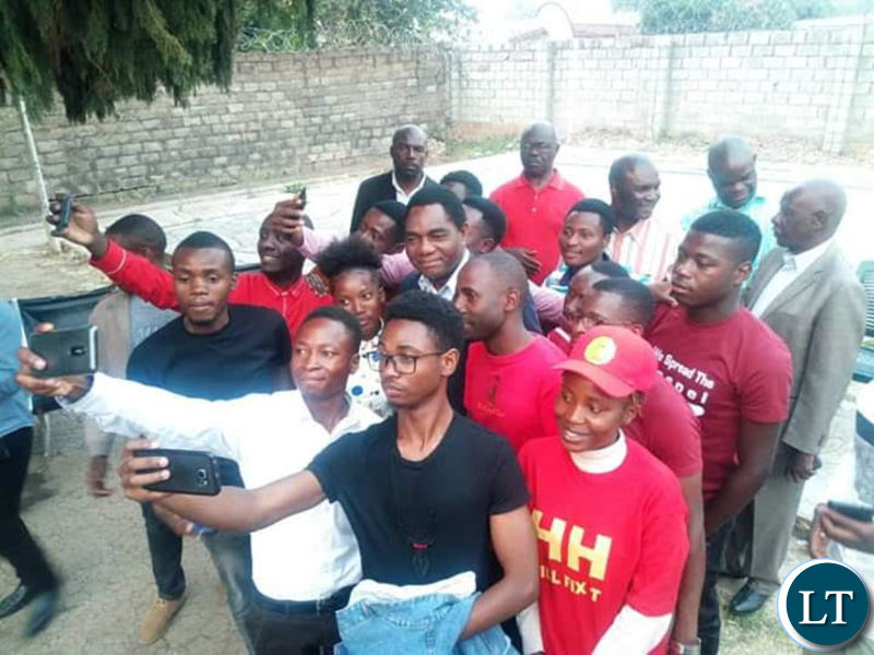 HH takes selfies with Evelyn Hone students at the UPND secretariat recently
