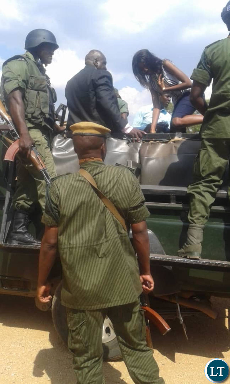 UPPZ leader Charles Chanda and daughter Esther being taken away by police