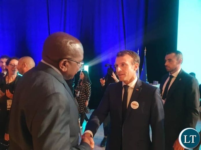 French President Emmanuel Macron took time to shake hands with Zambia's Health Minister, Hon. Dr. Chitalu Chilufya at the end of the Global Funds Replenishment Conference. President Macron thanked President Lungu and the people of Zambia for their generosity towards the Replenishment of the Global Funds. French President Emmanuel Macron took time to shake hands with Zambia's Health Minister, Hon. Dr. Chitalu Chilufya at the end of the Global Funds Replenishment Conference. President Macron thanked President Lungu and the people of Zambia for their generosity towards the Replenishment of the Global Funds.