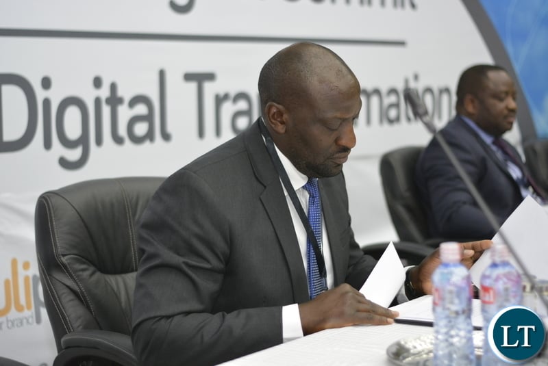Patrick Mutimushi, Director General ZICTA (reading through his speech before address)