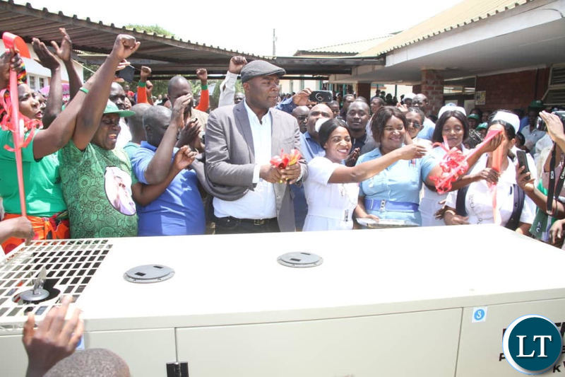 Kabushi Member of Parliament Bowman Lusambo hands over one of the four power gensets to Kabushi clinic on Saturday
