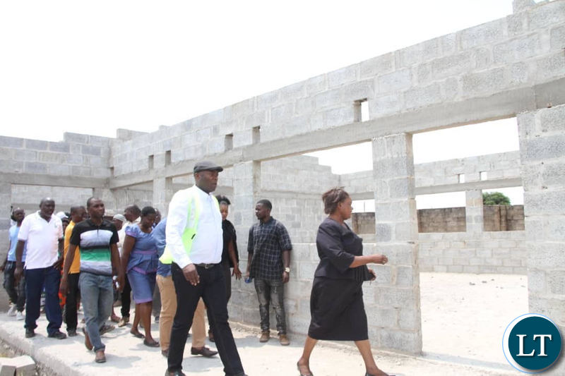 Kabushi Member of Parliament Bowman Lusambo tours the incomplete structure meant for a Maternity Annex at Kabushi Clinic on Saturday