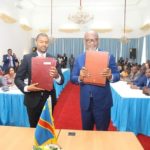 Housing and Infrastructure Development Minister Vincent Mwale with DRC Vice Premier and Minister of Infrastructure Sunzhel Ngoopos at the signing ceremony