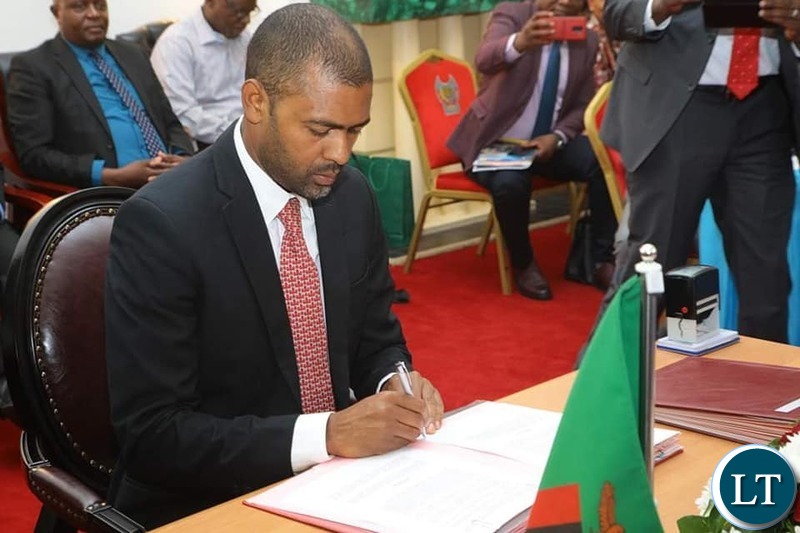 Housing and Infrastructure Development Minister Vincent Mwale with DRC Vice Premier and Minister of Infrastructure Sunzhel Ngoopos at the signing ceremony