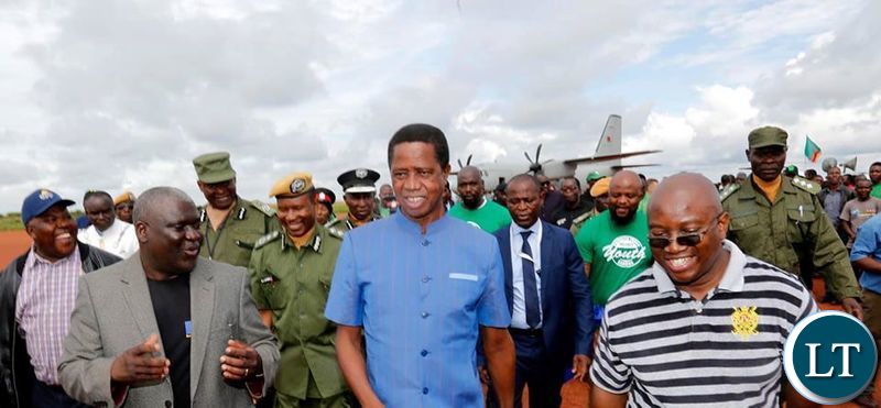 President Edgar Chagwa Lungu (centre) accompanied by Northern Province Minister Bwalya Chungu (left) and Kasama Member of Parliament Kelvin Sampa (right) at Kasama Airport in