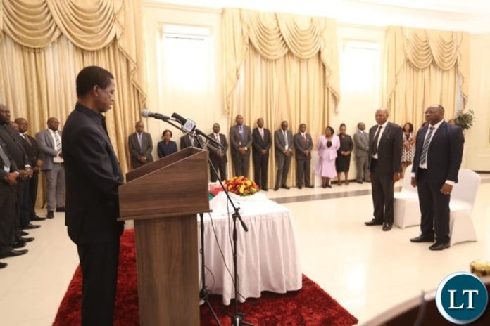 President Lungu during the swearing in ceremony of Deputy Auditor General in the office of the Auditor General, Francis Mbewe and Public Policy Specialist –Policy Analysis and Co-ordination Division at State House