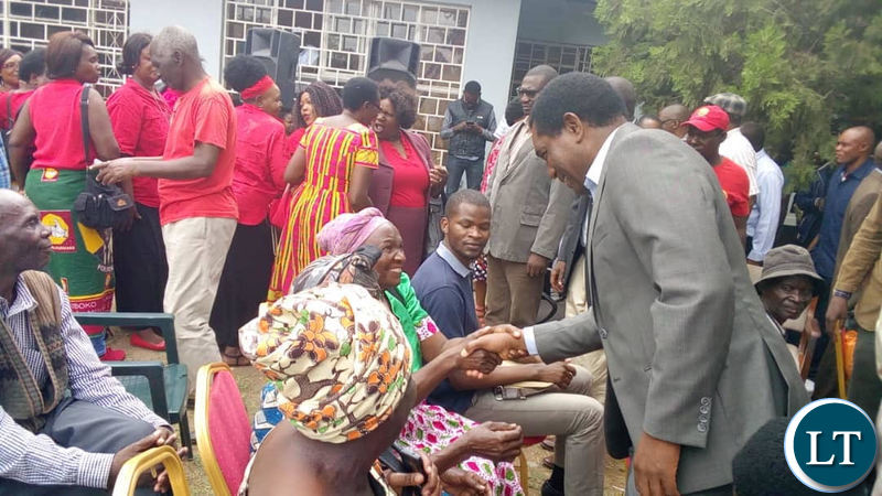 UPND leader Hakainde Hichilema greets ZSIC retirees who called on him at the party secretariat