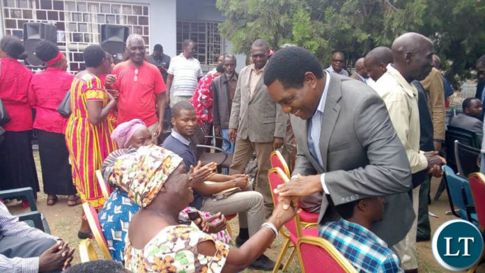 UPND leader Hakainde Hichilema greets ZSIC retirees who called on him at the party secretariat