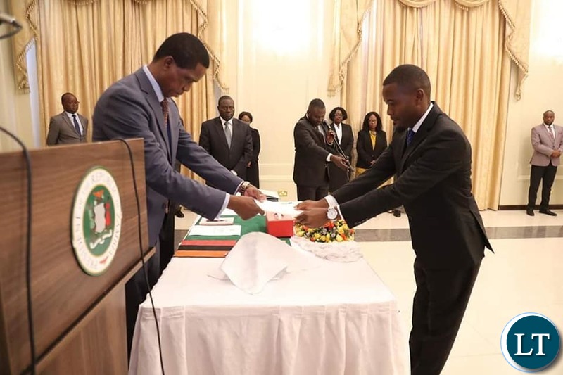 President Edgar Chagwa Lungu congratulates newly appointed Special Assistant to the President for Political affairs Chris Zimba during the Swearing in Ceremony at State House on Friday, December 20,2019 Pictures by EDDIE MWANALEZA
