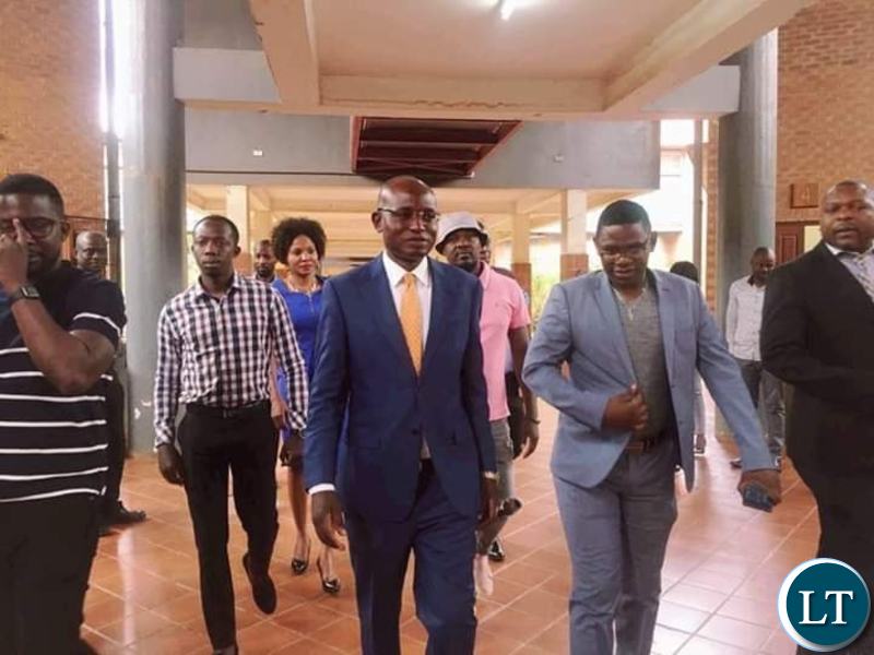 Amos Chanda in the company Chilufya Tayali after Appearing in Court